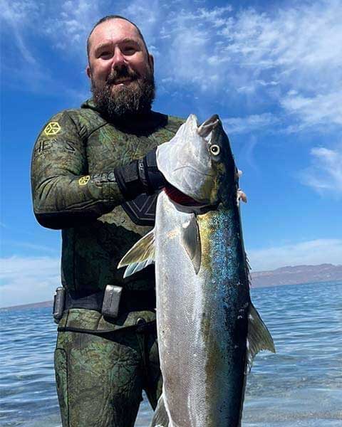 Tony with a yellowtail caught on a charter in Baja