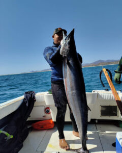 Diego with the fish of a lifetime, a Wahoo in Baja
